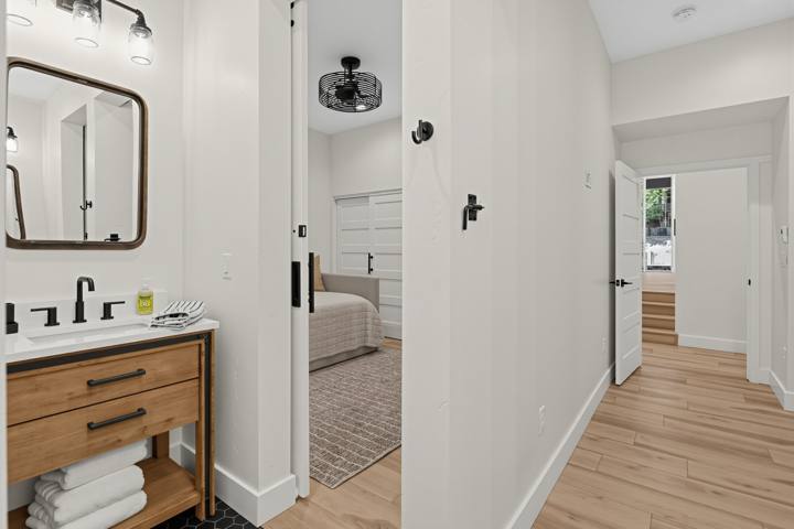 Jack-and-Jill bath with wood vanity
