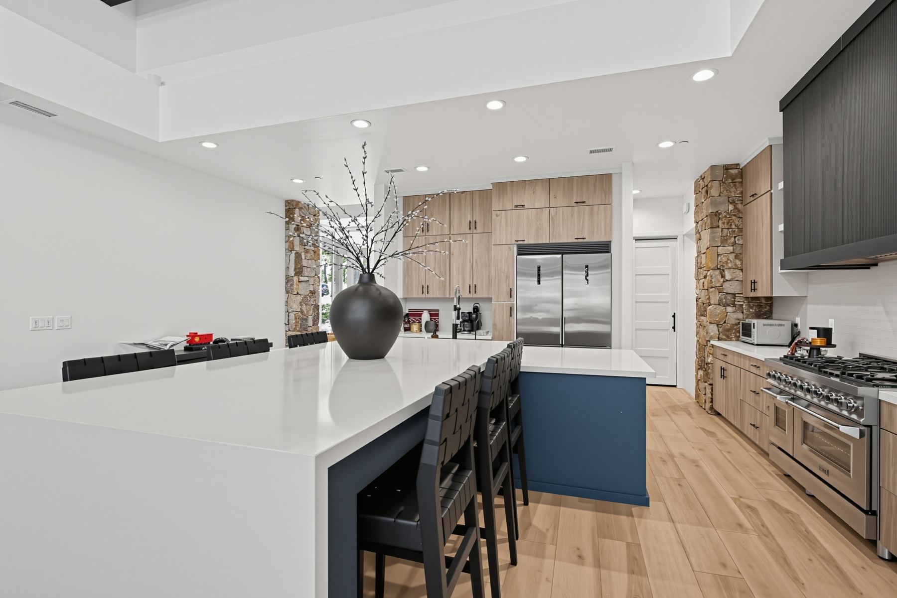 Kitchen island with bar seating in a furnished Flagstaff monthly rental