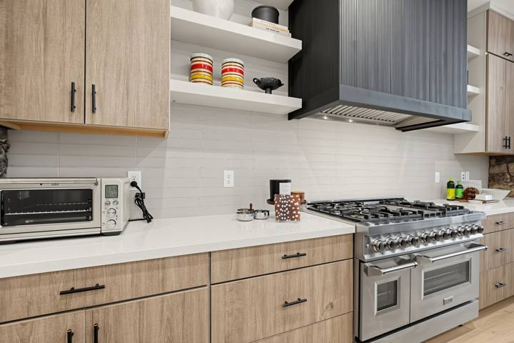 Professional-style gas range with double ovens and range hood