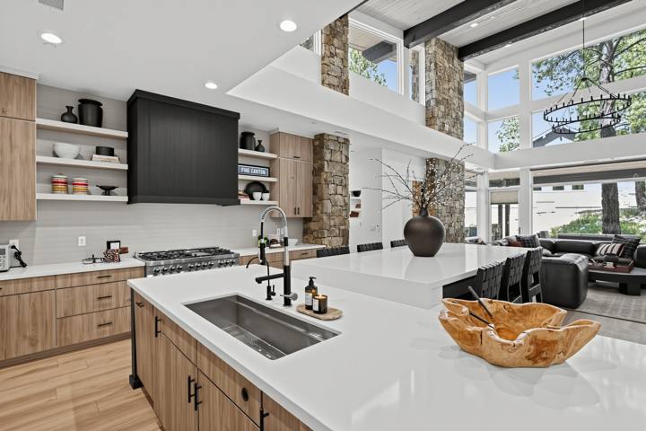 Kitchen island with quartz counters looking into the great room